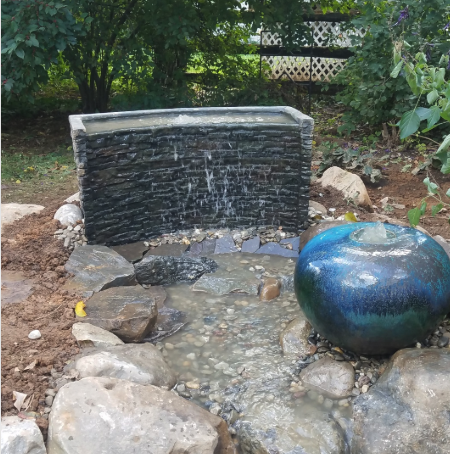 Want the Sound of Water Without the Maintenance? A Decorative Fountain Might Be Your Answer